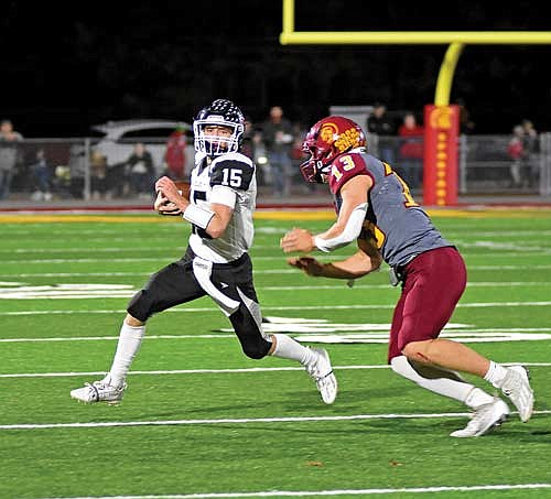 In this Oct. 20, 2023 file photo, Kort Meyer carries the football pursued by Sparta’s Thomas Laufenberg in a WIAA Division 3, Level 1 playoff game at Sparta Memorial Park Field. Meyer finished second team all-conference in his first year as a starting quarterback. (Photos by Brett LaBore/Lakeland Times)