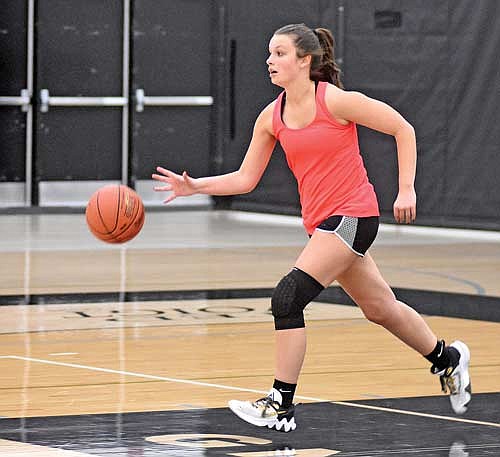 Alee Holmes dribbles the ball during a drill on the first day of practice Monday, Nov. 6 at Ted Voigt Court in Minocqua. (Photo by Brett LaBore/Lakeland Times)