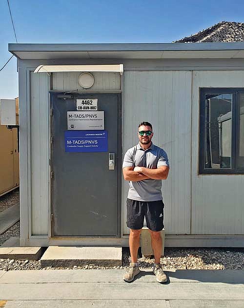 Bennett Handrick today working for Lockheed/Martin, outside his office in Iraq. (Contributed photograph)
