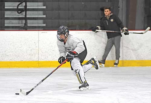 Joe Vizanko skates with the puck during the first week of practice Wednesday, Nov. 8 at Lakeland Ice Arena in Minocqua. (Photo by Brett LaBore/Lakeland Times)