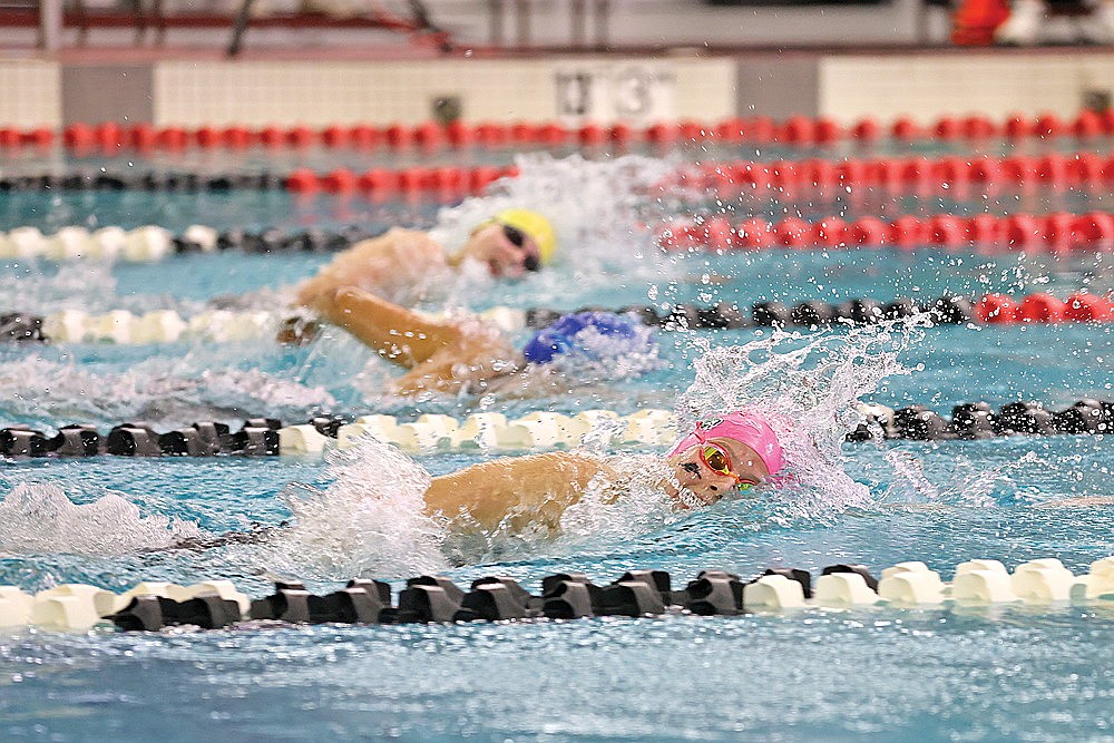 Rhinelander’s Abi Winnicki battles Ashwaubenon’s Sienna Nitke, top, and Whitefish Bay’s Anne Dickinson, middle, in the 200-yard freestyle during the WIAA Division 2 state championship in Waukesha Friday, Nov. 10. (Bob Mainhardt for the River News)