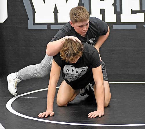 Zac Amershek, top, works on his footwork with partner Nolan Johnson during the first day of practice Monday, Nov. 13 at the Lakeland Union High School wrestling room in Minocqua. (Photo by Brett LaBore/Lakeland Times)