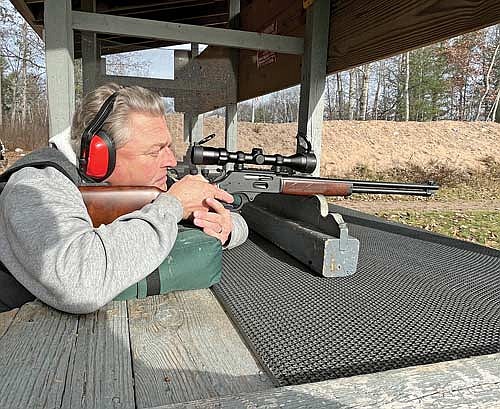 Dave Lorenzoni sights in his Henry .30-30 rifle at the C.W. Caywood Memorial Shooting Range on Tuesday, Nov. 14, in Arbor Vitae. Lorenzoni said he’s excited for the gun deer hunt this year, and may use a different rifle this weekend. (Photo by Trevor Greene/lakeland Times)