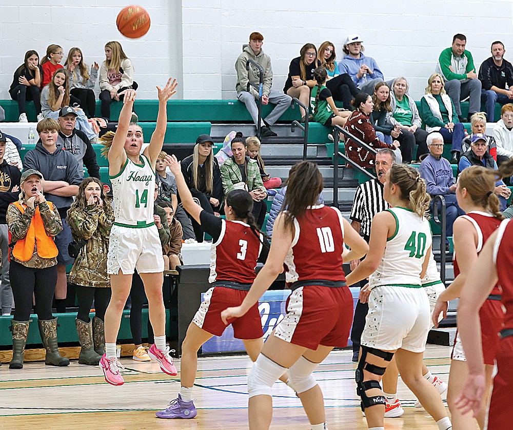 Rhinelander’s Lily Treder attempts a 3 over Crandon’s Samara Kane during the first half of a non-conference girls’ basketball game at the Jim Miazga Community Gymnasium Thursday, Nov. 16. The Hodags made a program-record 15 3-pointers in a 67-38 victory over the Cardinals. (Bob Mainhardt for the River News)