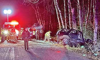 Authorities and emergency personnel at the scene of a fatal crash late last week near Eagle River. (Photo by Fred Williston/Lakeland Times)