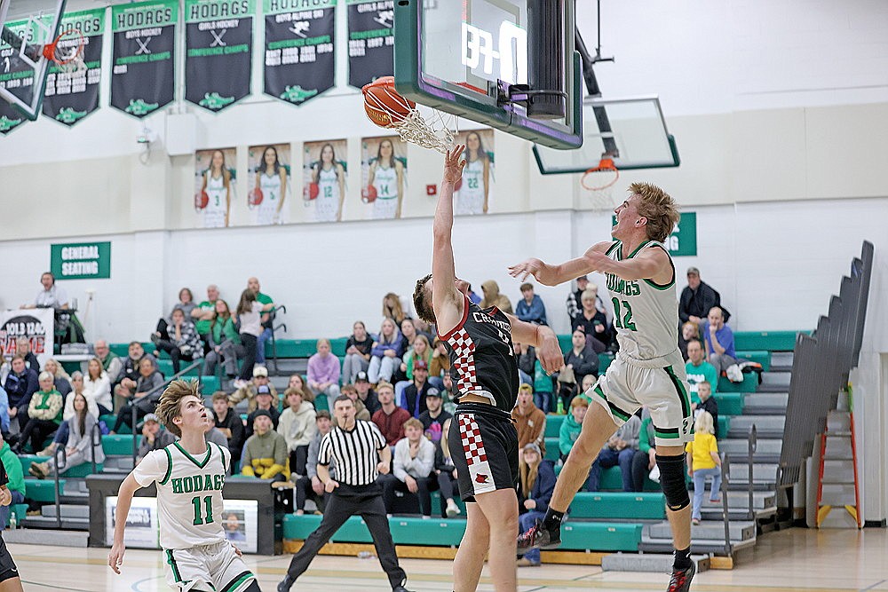 Rhinelander’s Truman Lamers dunks the basketball, defended by Crandon’s Jaxon Keepers, during the second half of a non-conference boys’ basketball game at the Jim Miazga Community Gymnasium Tuesday, Nov. 21. Lamers scored a game-high 23 points as the Hodags defeated the Cardinals, 72-56. (Bob Mainhardt for the River News)