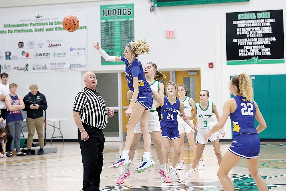 Rice Lake’s Adaline Sheplee wins the opening tipoff against Rhinelander’s Lily Treder in a non-conference girls’ basketball game at the Jim Miazga Community Gymnasium Monday, Nov. 20. Sheplee and her older sister, Eliana, combined to score 46 points as the Warriors defeated the Hodags 81-34. (Bob Mainhardt for the River News)