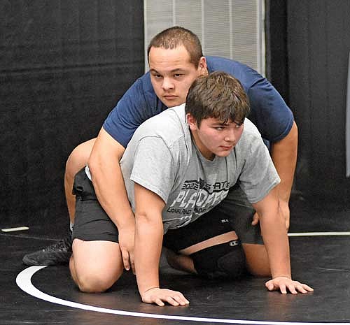 Esaube Brown, top, and Leonard Chosa work on a drill during the first day of practice Monday, Nov. 13 at the Lakeland Union High School wrestling room in Minocqua. Brown and Chosa are two returning all-conference wrestlers as seniors. (Photo by Brett LaBore/Lakeland Times)