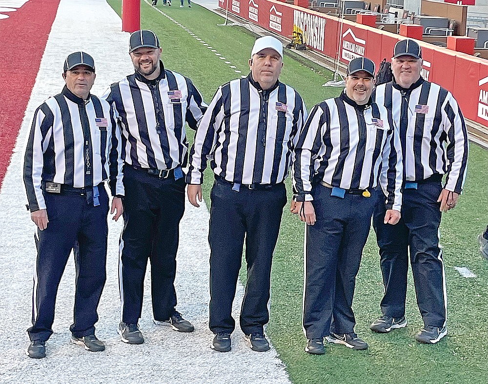 The Rhinelander-based crew that officiated the WIAA Division 2 state championship game poses for a photo at Camp Randall Stadium in Madison Friday, Nov. 17. Pictured from left to right are M.J. Laggis, Joe Waksmonski, Jeff Welk, Steve Vandervest and Scott Spencer. (submitted photo)