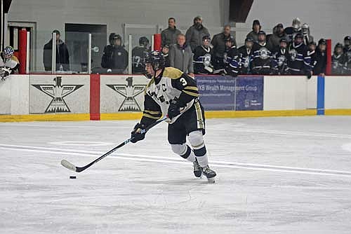 Matt Haggart controls the puck before scoring a second-period goal in the GNC opener against Mosinee Thursday, Nov. 30 at Lakeland Ice Arena in Minocqua. Haggart had the hat trick with three goals. (Photo by Brett LaBore/Lakeland Times)