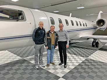 From left, Lakeland boys’ basketball varsity coach Jacob Jarvensivu, Trig Solberg and President of the Lakeland Basketball Boosters Matt Kock stand in front of Solberg’s plane he has donated to a raffle benefiting the Lakeland boys’ basketball youth and high school programs. (Contributed photograph)
