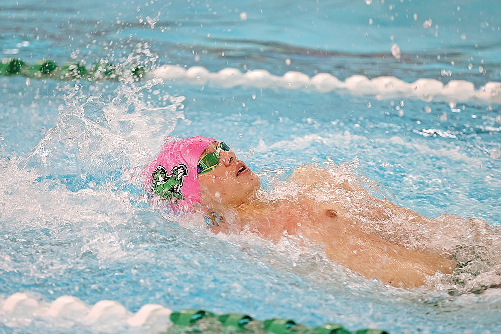 Rhinelander’s Zacha King swims a leg of the 300-yard backstroke relay during the Hodag Relays boys’ swim meet at the Heck Family Community Pool Saturday, Dec. 9. King was a member of two winning relays as Rhinelander finished second in the five-team meet. (Bob Mainhardt for the River News)