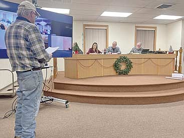 Lac du Flambeau resident Joe Hunt, left, addresses Lac du Flambeau town board members Gloria Cobb, Matt Gaulke and Bob Hanson at the town board’s Dec. 6 meeting. (Photo by Brian Jopek/Lakeland Times)