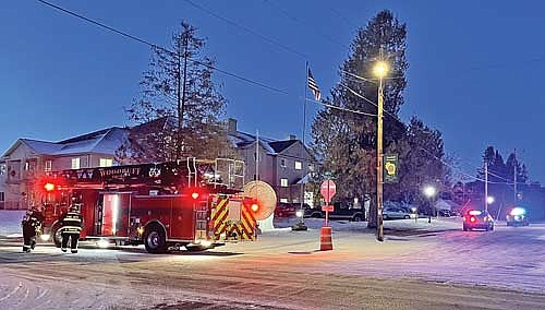 Woodruff firefighters arrive with the town’s ladder truck in response to what was reported to be an electrical fire but was a cooking fire in an apartment at One Penny Place in Woodruff on Tuesday, Dec. 12. (Photo by Brian Jopek/Lakeland Times)