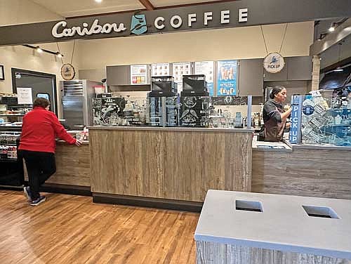 Baristas whip up coffee drinks for customers at the new full-service Caribou Coffee Cafe just outside the Rhinelander Trig’s store in the Riverwalk Centre mall. (Photo by Heather Schaefer/River News)