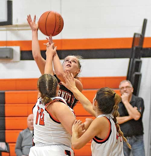 Amber Eith (10) and Ona Ruiz contest the shot of Butternut’s Jersey Polencheck in the second half Thursday, Dec. 14 at Coach Leverson Court in Mercer. Polencheck finished with 19 points, below her season average. (Photo by Brett LaBore/Lakeland Times)