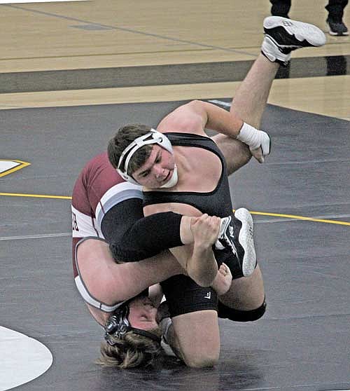 Lakeland senior Leonard Chosa works for a takedown against Antigo sophomore Caleb Vandenlangenberg at the 215-pound class during a wrestling meet Thursday, Dec. 14 at the Lakeland Union High School fieldhouse in Minocqua. (Photo by Trevor Greene/Lakeland Times)