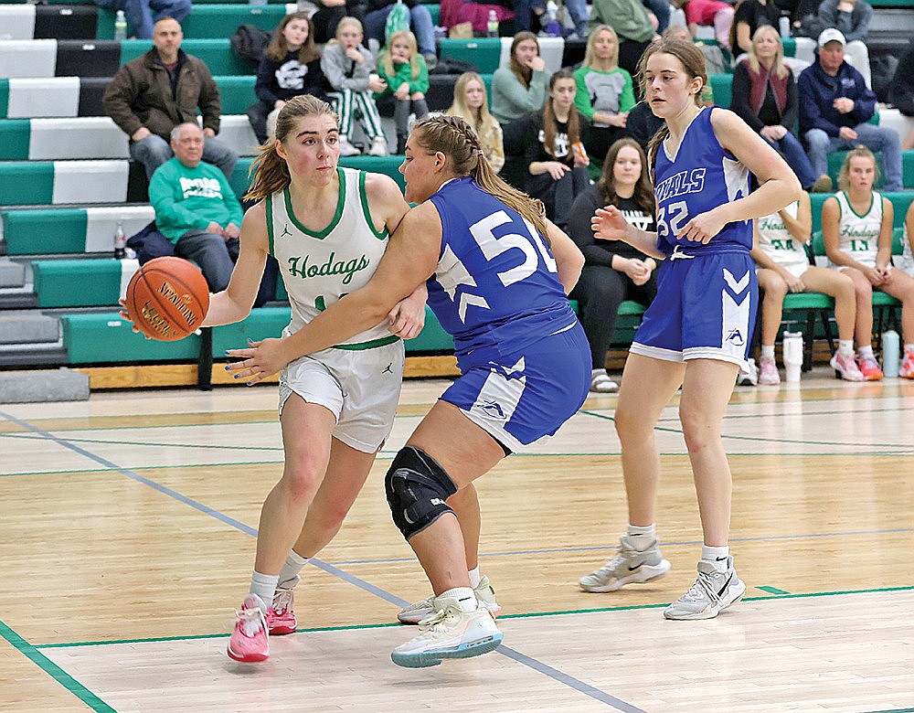 Rhinelander’s Lily Treder look to make a pass along the baseline against Wisconsin Rapids Assumption’s Rylee Stublaski during the second half on a non-conference girls’ basketball game at the Jim Miazga Community Gymnasium Monday, Dec. 18. (Bob Mainhardt for the River News)