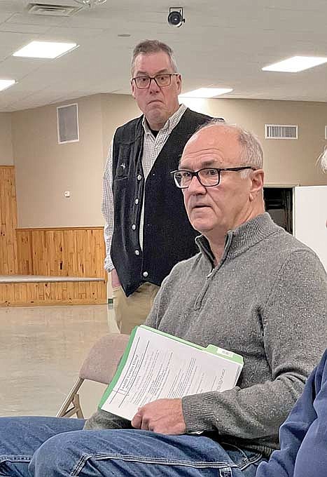 Conover town supervisor Karl Jennrich, left, listens to his fellow Conover town board member Joe Muehlbach at the Friday, Dec. 15 meeting of the Landfill Venture Group in Arbor Vitae. (Photo by Brian Jopek/Lakeland Times)