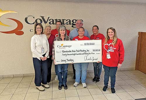 CoVantage staff members are pictured with Rhinelander Area Food Pantry representatives who received a check totaling $20,825.48 from the CoVantage Cares Giving Tuesday Fundraiser. (Submitted photo)