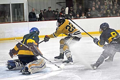 Gray Wagner scores a goal past Tomahawk goalie Trevor Seliskar in the first period Thursday, Jan. 4 at Lakeland Ice Arena in Minocqua. (Photo by Brett LaBore/Lakeland Times)