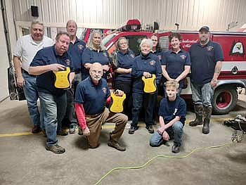 Members of the Little Rice Fire Department hold the Automated External Defibrillators purchased with funding received from the Marshfield Clinic Health System, Inc Community Engagement, CoVantage Cares Foundation, and the Sacred Heart Hospital Foundation. (Submitted photo)
