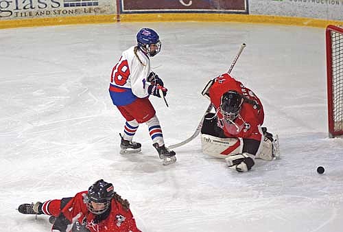 Taylor Heleniak scores a goal past Medford goalie Zayleah Leonhardt to set a new Lakeland Union High School girls’ hockey record for career goals with 62 during the second period Monday, Jan. 8 at Eagle River Sports Arena. Heleniak has 64 career goals in 47 games played. (Photo by Brett LaBore/Lakeland Times)