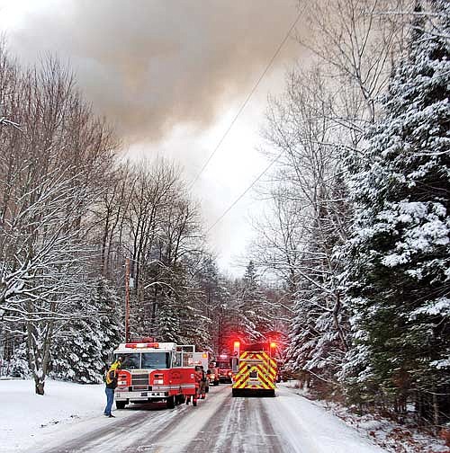 Smoke rises from a fire that burned down a home on County Highway Y in Little Rice Monday, Jan. 8, 2024. (Photo by Brian Jopek/Lakeland Times)