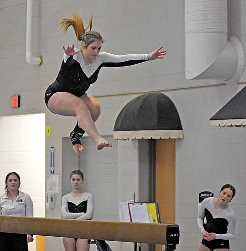 Vicky Wiza leaps on the balance beam during a meet against Antigo Thursday, Jan. 11 at Lakeland Union High School in Minocqua. Wiza finished second in the all-around with a total score of 27.675. (Photo by Brett LaBore/Lakeland Times)