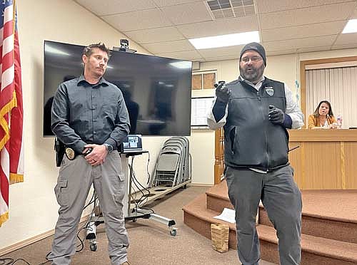 George Hopfensperger, left, a drug investigator with the Lac du Flambeau Tribal Police Department, and department police chief T.J. Bill make a presentation to the Lac du Flambeau town board and those in attendance at the town board’s Jan. 10 meeting. (Photo by Brian Jopek/Lakeland Times)