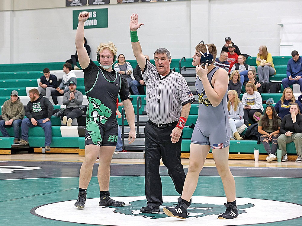Rhinelander’s Owen Kurtz raised his arm after defeating Tomahawk’s Skylar Harper Dalvig during a triangular meet at the Jim Miazga Community Gymnasium Thursday, Jan. 18. It marked the 100th career win for Kurtz. (Bob Mainhardt for the River News)