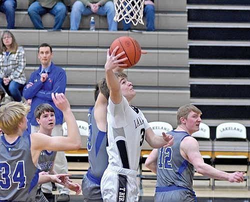 Nate Ariola scores the first basket of the game in the first half against Three Lakes Tuesday, Jan. 23 at Ted Voigt Court in Minocqua. (Photo by Brett LaBore/Lakeland Times)