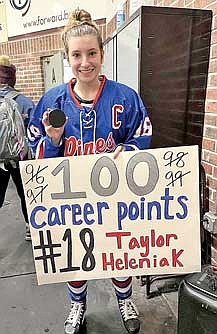 Taylor Heleniak celebrates her 100th career point after a game against Wisconsin Valley Union Saturday, Jan. 20 at Marshfield Area Ice Arena. Heleniak scored a short handed goal in the third period to get to 100 career points. (Contributed photograph)