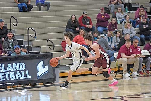 Benny Gahler dribbles the ball up the court against the defense of Antigo’s Colton Thomae in the second half of a 58-38 win Friday, Jan. 26 at Ted Voigt Court in Minocqua. (Photo by Brett LaBore/Lakeland Times)