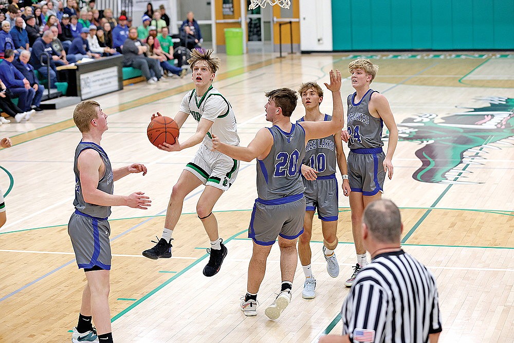 Rhinelander’s Will Gretzinger flies past Three Lakes’ LJ Terlizzi for a layup during the first half of a non-conference boys’ basketball game at the Jim Miazga Community Gymnasium Tuesday, Jan. 30. Gretzinger scored a game-high 28 points in the Hodags 64-51 victory. (Bob Mainhardt for the River News)