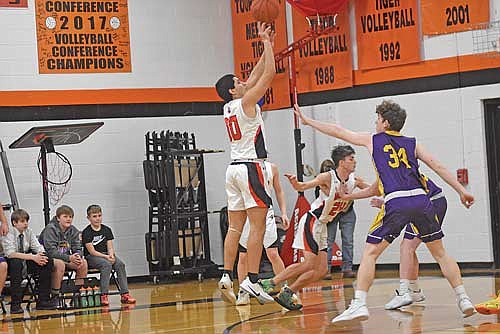 Luis Segura-Martell takes a jump shot against the defense of Drummond’s Aaron Christenson in the first half Friday, Feb. 2 at Coach Leverson Court in Mercer. (Photo by Brett LaBore/Lakeland Times)