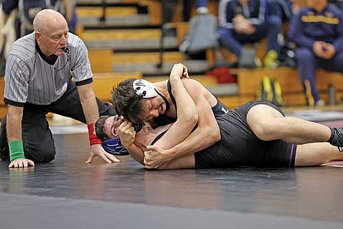 Jerome LaBarge, top, looks to pin Mosinee’s Noah Nechuta in the 144-pound class during the GNC Meet Saturday, Feb. 3 at Sheldon Fieldhouse in Antigo. LaBarge won the conference championship at the 144-pound class. (Photo by Bob Mainhardt for the River News)