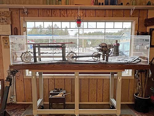 The original snowmobile Eliason created in 1924 on display at Eliason Hardware in Sayner. According to Jona Eliason, this was the design “built from the ground-up.” She said it was built to be nothing but a snowmobile. “None of the other single-tracked snow machine patents prior to this used a ‘working prototype,’ they just submitted drawings with no working machine to prove the design worked.” (Photo by Kate Reichl/Lakeland Times)