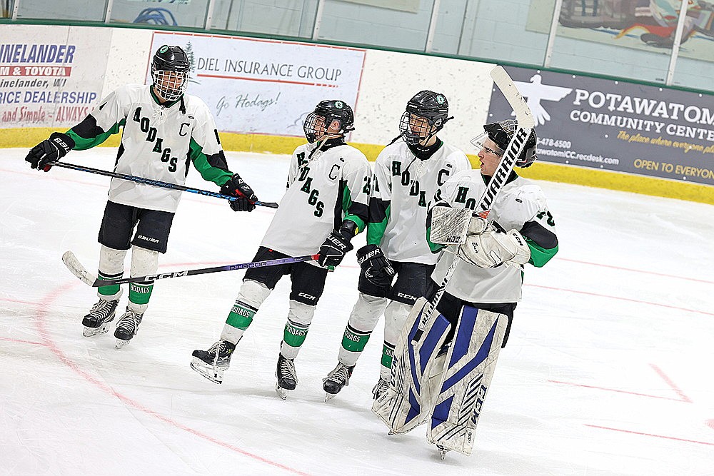 Rhinelander seniors, from left to right, Joey Belanger, Gavin Denis, Dalton Fritz and Tyler Kimmerling take a victory lap after the Hodags’ 5-1 victory over Ashland in a non-conference boys’ hockey game at the Rhinelander Ice Arena Saturday, Feb. 3. It marked the final regular season home game for the Hodag seniors. (Bob Mainhardt for the River News)