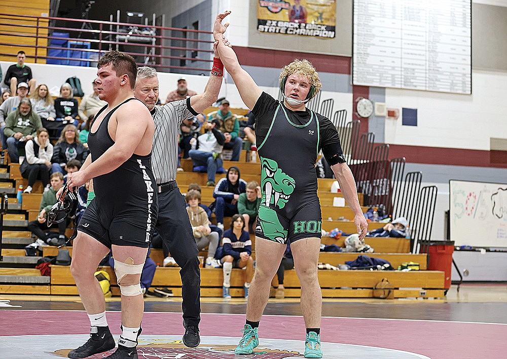 Rhinelander’s Owen Kurtz gets his arm raised after defeating Lakeland’s Leonard Chosa during the GNC wrestling tournament in Antigo Saturday, Feb. 3. Kurtz won the GNC title at 215 pounds and was named GNC co-wrestler of the year. (Bob Mainhardt for the River News)