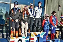 Leo Rotar and Stella Meza, left, stand on the podium after finishing second during the mixed team sprint in the Wisconsin Nordic Ski League Team Sprint Championships Saturday, Feb. 3 at Ariens Center in Brillion. (Contributed photograph)