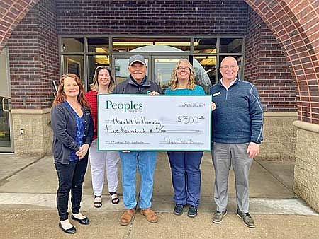 Peoples State Bank employees recently made a donation to the Bids for Builds auction. Pictured are Christy Seidel, Jamie Schultz, Dave Havel (Habitat for Humanity executive director), Lori Palmer and Erin McCormick. (Submitted photo)