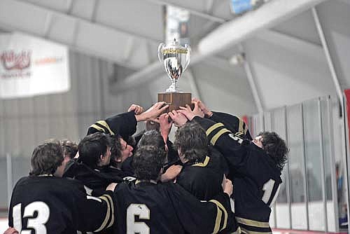 The Thunderbirds lift the trophy after beating Tomahawk 2-0 in the GNC Tournament championship game Saturday, Feb. 10 at Mosinee City Recreation Center. (Photo by Brett LaBore/Lakeland Times)
