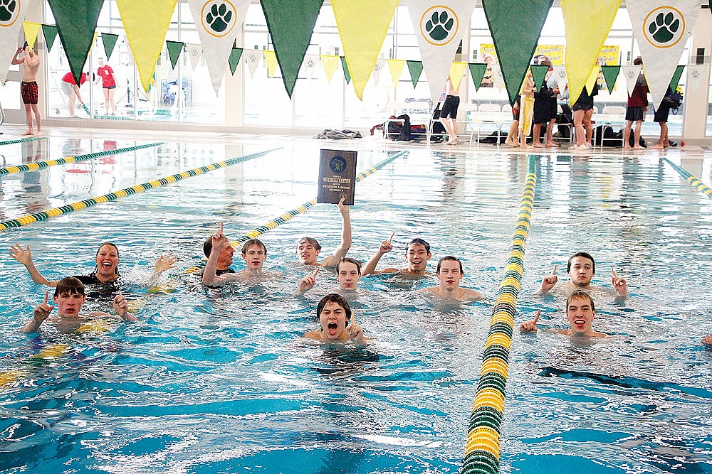 The Rhinelander High School boys’ swim team celebrates in the pool after winning its sixth consecutive WIAA Division 2 sectional championship in Ashwaubenon Saturday, Feb. 10. The Hodags advanced 16 entries to the WIAA state meet as they beat the hosting Jaguars by 24 points for the sectional crown. (Jeremy Mayo/River News)