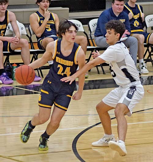 Taedyn Hernandez guards Wausau West’s Cole Roerdink in the second half Thursday, Feb. 15 at Ted Voigt Court in Minocqua. (Photo by Brett LaBore/Lakeland Times)