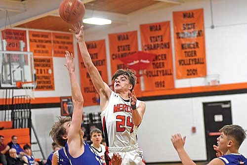 Conrad LaBarge makes a jumper in the second half against Mellen Friday, Feb. 16 at Coach Leverson Court in Mercer. LaBarge led the Tigers with 22 points. (Photo by Brett LaBore/Lakeland Times)