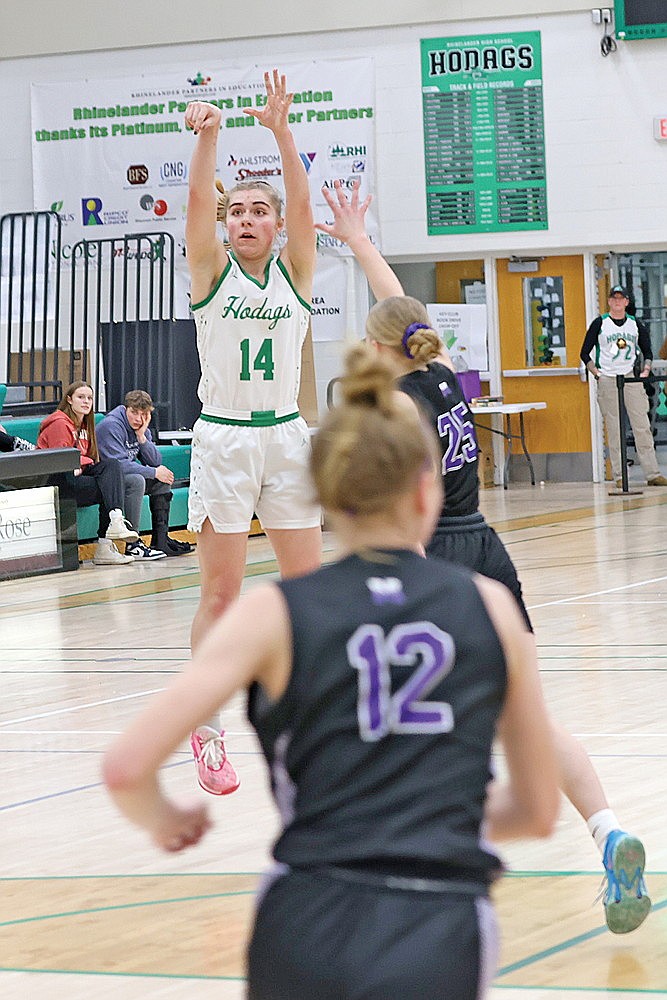 Rhinelander’s Lily Treder attempts a 3-pointer during the first half of a GNC girls’ basketball game at the Jim Miazga Community Gymnasium Friday, Feb. 16. Treder made the shot and broke a school record by making her 76th 3-pointer of the season. (Bob Mainhardt for the River News)