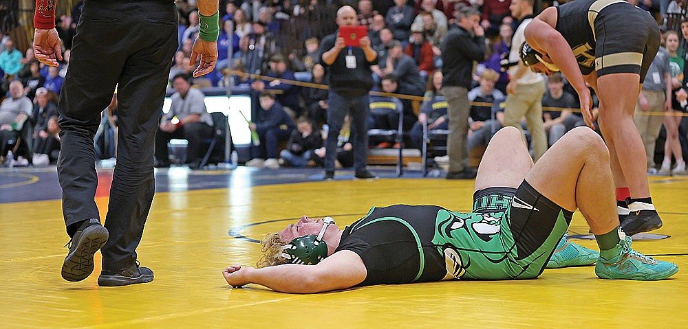 Rhinelander’s Owen Kurtz lays on the mat after falling to Hayward’s Bradey Gottwald in a third-place match at 215 pounds in a WIAA Division 2 sectional meet in Tomahawk Saturday, Feb. 17. Kurtz finished fourth, one spot away from qualifying for his first WIAA state tournament. (Bob Mainhardt for the River News)