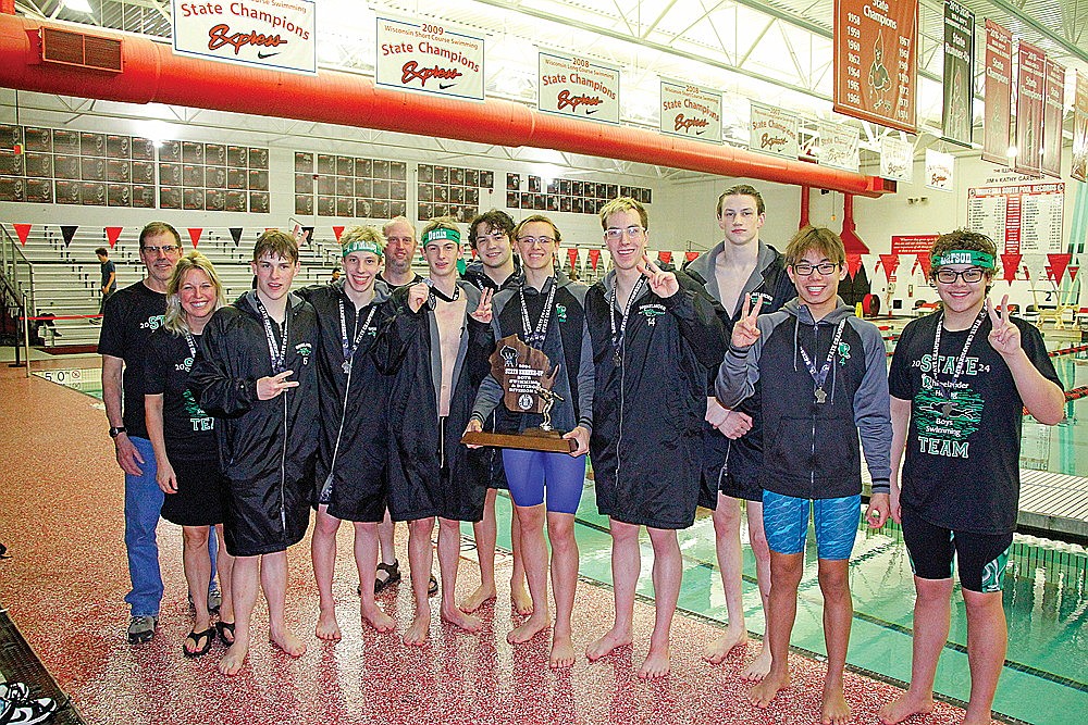 The Rhinelander High School boys’ swim team poses for a photograph following a runner-up finish at the WIAA Division 2 state boys’ swim meet in Waukesha Friday, Feb. 16. The group, from left to right, includes coach Dan Jesse, head coach Jenny Heck, Brock Arrowood, Judson O’Malley, coach Brent Olson, Shawn Denis, Samson Shinners, Zacha King, Dolan O’Malley, Mathias Fugle, Charlie Antonuk and Christopher Larson. (Jeremy Mayo/River News)