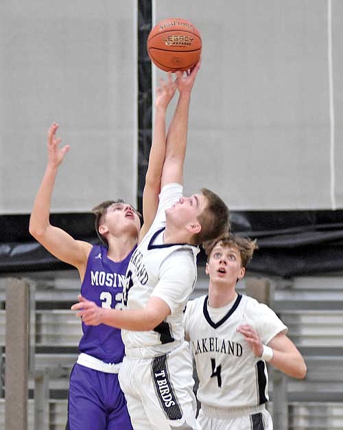 Nate Ariola and Mosinee’s Landen Thomer fight for a rebound in the second half of the regular season finale Thursday, Feb. 22 at Ted Voigt Court in Minocqua. (Photo by Brett LaBore/Lakeland Times)